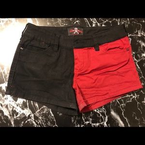 Half black/ half red shorts